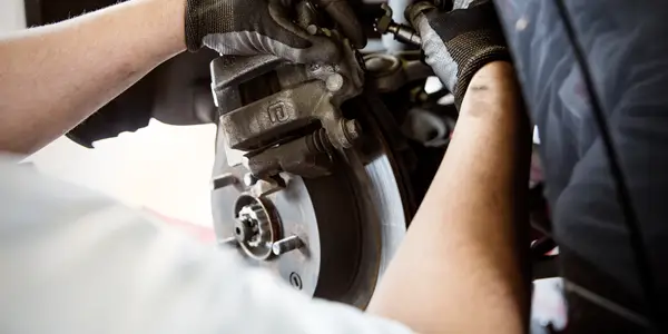 Mechanic working on brakes