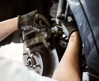 Mechanic working on brakes